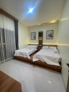 Ένα ή περισσότερα κρεβάτια σε δωμάτιο στο Athara Villas Kav 42