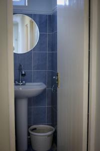a bathroom with a sink and a mirror at MARY in Stepʼanavan