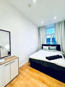 Voodi või voodid majutusasutuse Comfy & Cozy 4BR Shared Apt next to Kaufpark Alterlaa toas