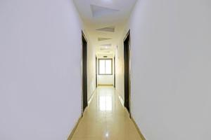 a corridor of an office building with a white wall at Hotel O Yugantar Palace in Gwalior