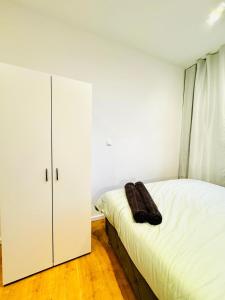Voodi või voodid majutusasutuse Comfy & Cozy 4BR Shared Apt next to Kaufpark Alterlaa toas