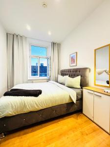 Voodi või voodid majutusasutuse Comfy & Cozy 4BR Shared Apt next to Kaufpark Alterlaa toas