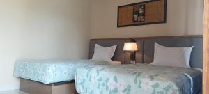 Bloom Home Stay客房内的一张或多张床位