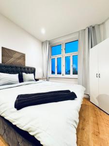 Voodi või voodid majutusasutuse Comfy & Cozy 4BR Shared Apt next to Kaufpark Alterlaa toas