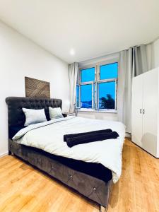 Voodi või voodid majutusasutuse Comfy & Cozy 4BR Shared Apt next to Kaufpark Alterlaa toas
