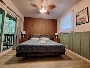 Voodi või voodid majutusasutuse Wild Ginger Hotel toas