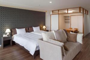 Voodi või voodid majutusasutuse Izumigo AMBIENT Izu-Kogen Condominium toas