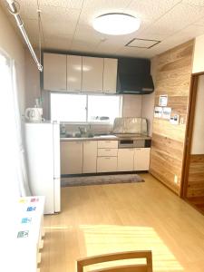 Η κουζίνα ή μικρή κουζίνα στο オレンジコーポ 201号室