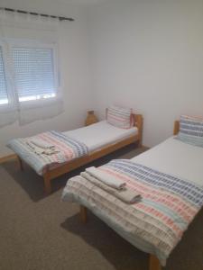 Postel nebo postele na pokoji v ubytování Apartman Avdić