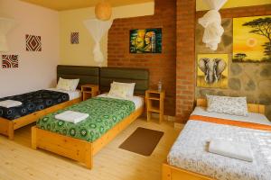 Postel nebo postele na pokoji v ubytování Yambi Guesthouse
