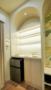 a kitchen with a sink and a window in a room at The Ylang Ylang Events Place in Mangatarem