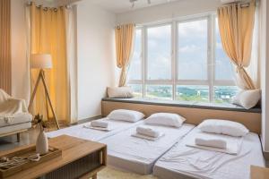 Un pat sau paturi într-o cameră la Luxury Homestay Cyberjaya Putrajaya Vision Residence #IOICityMall +103 fotografii