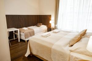 Posteľ alebo postele v izbe v ubytovaní Luxury Modern Designed Oldtown Apartment