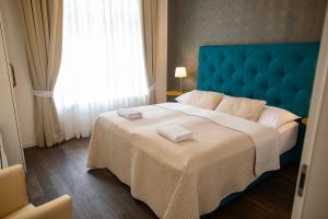 Posteľ alebo postele v izbe v ubytovaní Luxury Modern Designed Oldtown Apartment
