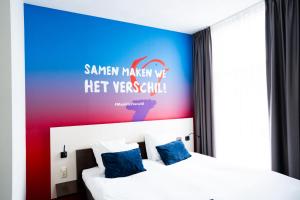 Postel nebo postele na pokoji v ubytování Hotel de Wereld