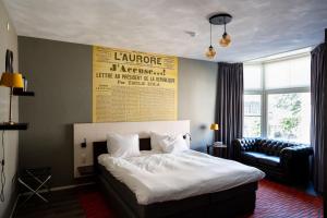 Postel nebo postele na pokoji v ubytování Hotel de Wereld