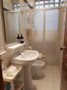a bathroom with a sink and a toilet at la casa al mare in Pescara +27 photos