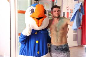 a shirtless man is holding a costume of a chicken at Camping les Alouettes - Bretignolles-sur-Mer in Bretignolles-sur-Mer +69 photos