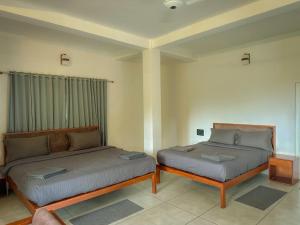 Voodi või voodid majutusasutuse Forestscape Resort Munnar toas
