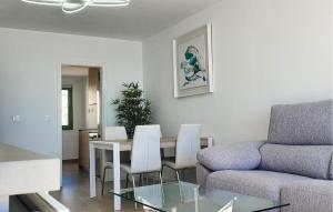 a living room with a couch and a table and chairs at Casa Cantal in Mojácar
