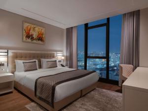 Postel nebo postele na pokoji v ubytování Movenpick Living Istanbul West