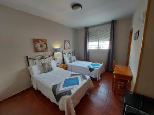 Posteľ alebo postele v izbe v ubytovaní Hostal Costa Rica