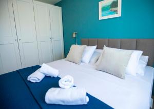 En eller flere senge i et værelse på Apartment Laura-Villa La dolce vita + 94 billeder