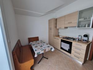 a small kitchen with a table and a stove at Ca'Montebosco in San Pietro Viminario