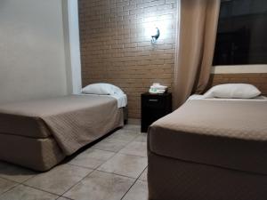 Hotel Capri客房内的一张或多张床位