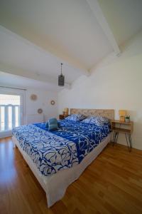 En eller flere senge i et værelse på Maison au bord du bassin de Thau