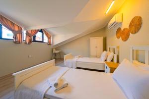 Postel nebo postele na pokoji v ubytování Villa Aromatherapy