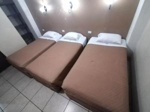 Hotel Capri客房内的一张或多张床位
