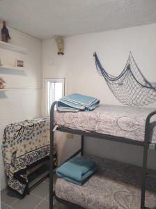 A bed or beds in a room at Mi morena cala llobeta 35