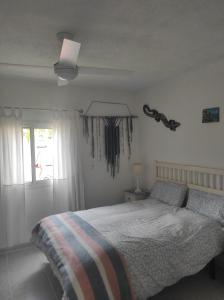A bed or beds in a room at Mi morena cala llobeta 35