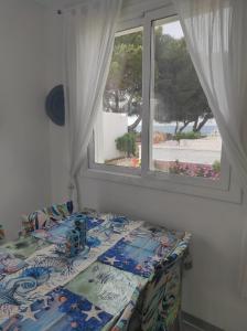 A bed or beds in a room at Mi morena cala llobeta 35