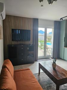 Televízia a/alebo spoločenská miestnosť v ubytovaní Studio apartmen
