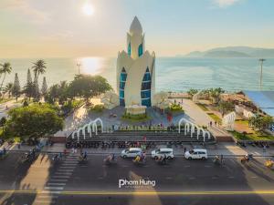 an aerial view of a building in front of the ocean at ANNIE HOUSE Nha Trang- One bedroom cozy apartment near the beach & Tram Huong Tower with big promo in Nha Trang