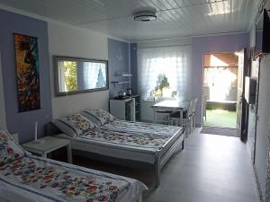 Postel nebo postele na pokoji v ubytování Anrema - Pokoje 21m2