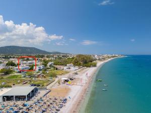 an aerial view of a beach and the ocean at Blue Wave Suites - Ixia in Ialysos +86 photos