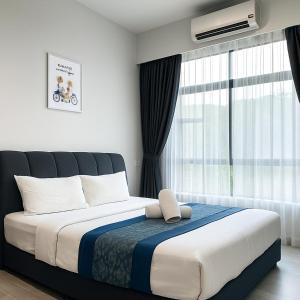 Postel nebo postele na pokoji v ubytování ENDLESS SUMMER Jesselton Quay Kota Kinabalu 來繕旅遊