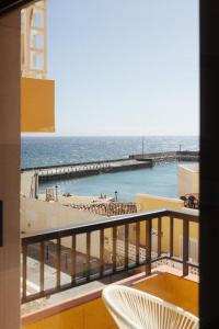 a view of the ocean from the balcony of a hotel at Hidalga Piso con terraza y vistas al mar in Puertito de Güímar