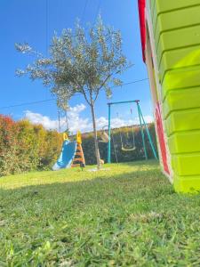 a playground with two swings and a tree at Damar in Giarre +46 photos