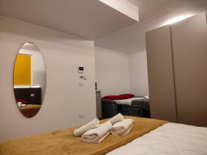Ένα ή περισσότερα κρεβάτια σε δωμάτιο στο CconfortHotels Maison 104