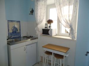 a small kitchen with a sink and a window at Blue dreams in Dubrovnik