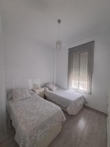 Postel nebo postele na pokoji v ubytování Casa Cañada