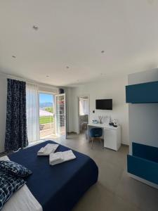 Postel nebo postele na pokoji v ubytování Orizzonte Mare Panoramic Rooms