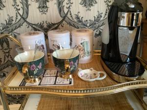 a tray with cups and a blender on a table at Tatson Farmhouse B&B in Bridgerule