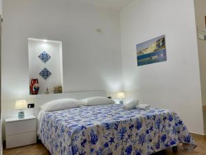 Postel nebo postele na pokoji v ubytování B&B Scala dei Turchi Beach