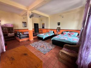 Una cama o camas en una habitación de Siddhartha Garden Ayurveda