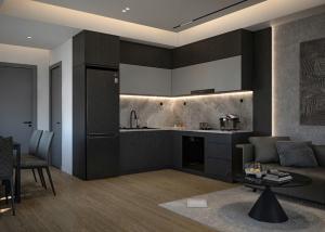 a kitchen and living room with a couch and a table at HighClass Suites - Walk-To-Independence Palace, SaiGon's Heart in Ho Chi Minh City